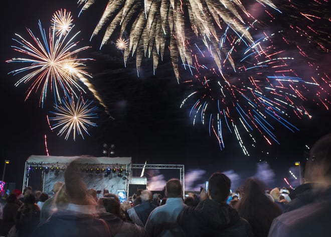 Fireworks burst over Pier Park in St. Augustine Beach as hundreds of people gather to celebrate New Year’s Eve at Beach Blast Off on Dec. 31. [CHRISTINA KELSO/THE RECORD]
