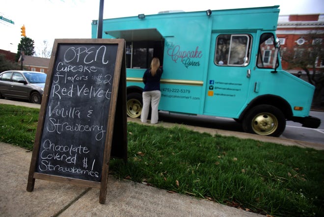 Carla Spry sells cupcakes and chocolate-covered strawberries at her mobile bakery. [Brittany Randolph/The Star]