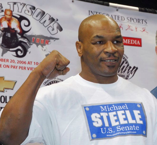 In a Thursday, Oct. 19, 2006 file photo, former heavyweight champion Mike Tyson pumps his fist in the air during his weigh-in at the Chevrolet Centre in Youngstown, Ohio. Living Word Sanctuary Church is converting a Southington Township, Ohio mansion once owned by Tyson into a house of worship. (AP Photo/Mark A. Stahl, File)