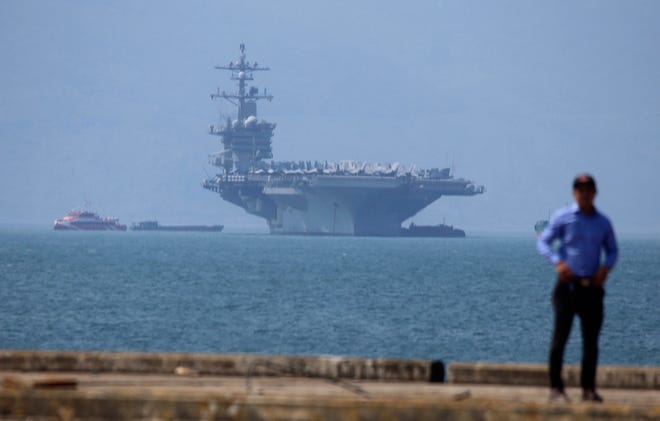 USS Carl Vinson is anchored at Tien Sa Port in Danang, Vietnam, Monday, March 5, 2018. For the first time since the Vietnam War, the U.S. Navy aircraft carrier is paying a visit to a Vietnamese port, seeking to bolster both countries' efforts to stem expansionism by China in the South China Sea. (AP Photo/Tran Van Minh)