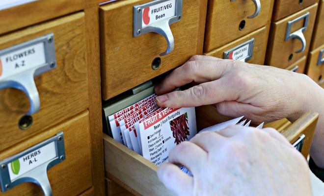 The new seed library at Herrick District Library includes 78 varieties of fruit, vegetable, herb and flower seeds sorted in an upcycled old card catalog cabinet. [Courtesy]