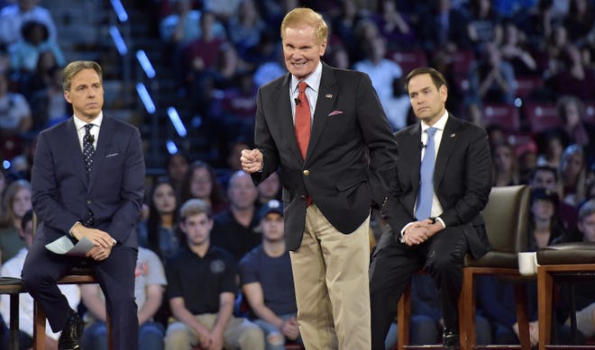 In this Feb. 21 photo, Sen. Bill Nelson speaks during a CNN town hall meeting in Sunrise. CNN host Jake Tapper, left, and U.S. Senator Marco Rubio are seen in the background. [Michael Laughlin/South Florida Sun-Sentinel via AP/File]