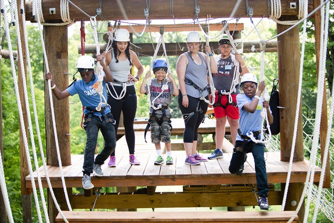 The high ropes course at Flying Horse Farms is accessible to all campers, even those who use wheelchairs.