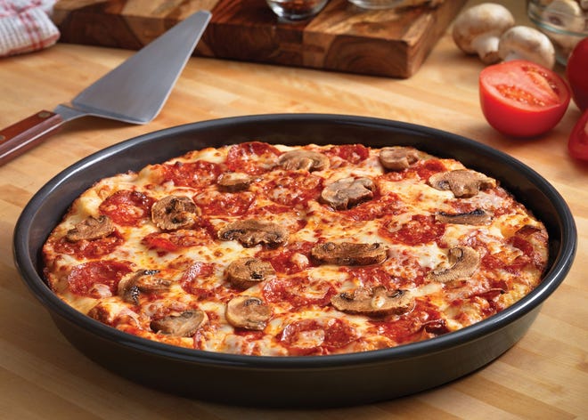 Domino's focuses on creating new tech and then develops engaging advertising around it to connect with customers and stand out in a fragmented field with national chains, regional stores and independent players. Seen here is Domino's pan pizza. (File Photo)