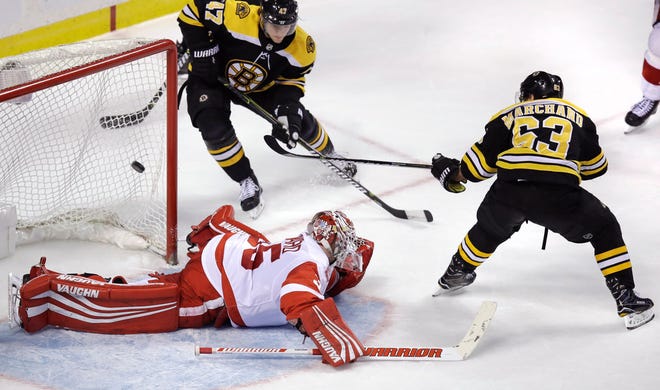 Brad Marchand backhanded the puck past Detroit goalie Jimmy Howard for the winning goal in overtime on Tuesday night.