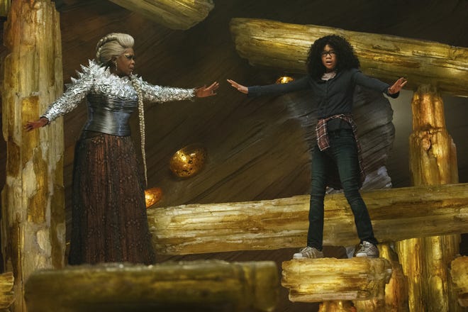 This image released by Disney shows Oprah Winfrey, left, and Storm Reid in a scene from "A Wrinkle In Time." (Atsushi Nishijima/Disney via AP)