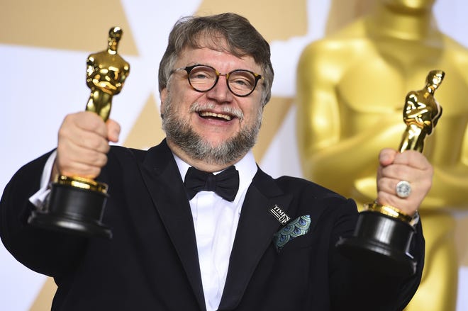 Guillermo del Toro, winner of the awards for best director and best picture for "The Shape of Water," poses in the press room at the Oscars on Sunday, March 4, 2018, at the Dolby Theatre in Los Angeles. [Photo by Jordan Strauss/Invision/AP]