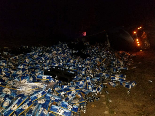 Scene from the overturned semi that left nearly 30 tons of canned beer along Interstate 10 early Wednesday morning. [SPECIAL TO THE DAILY NEWS]