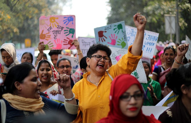 Indian women shout slogans during a march to observe International Women's Day in New Delhi, India, Thursday, March 8, 2018. Hundreds of women held street plays and march in the Indian capital highlighting domestic violence, sexual attacks and discrimination in jobs and wages against them. Violent crime against women has been on the rise in India despite tough laws enacted by the government. (AP Photo/Manish Swarup)