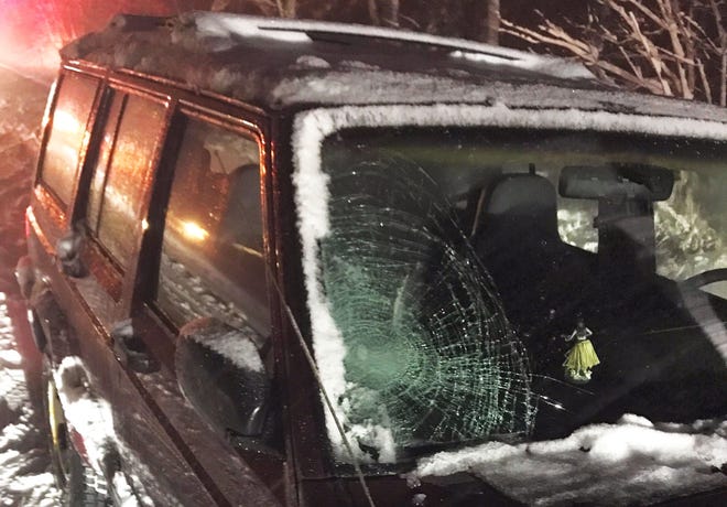 The broken windshielf on this Jeep shows the point of impact from a collision with a pedestrian on Haven Hill Road in Rochester on Wednesday night during the snowstorm. Poor visibility is a factor in the accident, police said. [Photo/Rochester Police]