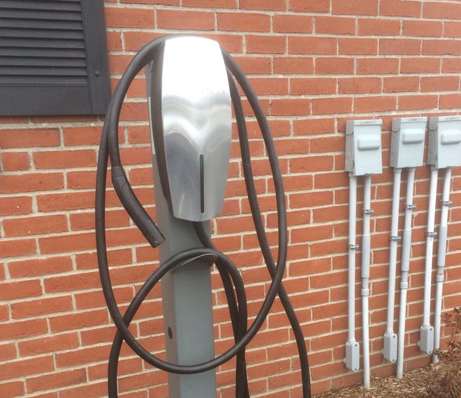 A Tesla electric charging station at the Port Inn in Portsmouth. Tesla will give Dover two charging stations for the parking garage plus $2,000 for installation if Dover covers the remaining costs. [Brian Early/Foster.com]