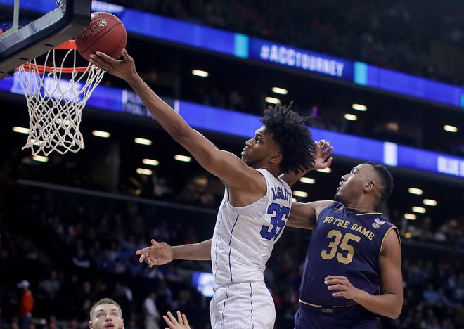 Duke forward Marvin Bagley III (35) shoots against Notre Dame forward Bonzie Colson (35) during the second half of an NCAA college basketball game in the Atlantic Coast Conference men's tournament Thursday, March 8, 2018, in New York. (AP Photo/Julie Jacobson)
