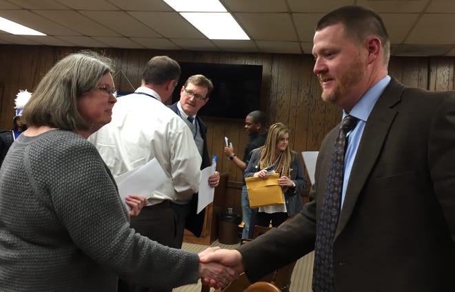 Jeff Colegrove is greeted by a well-wisher Thursday after being named the next superintendent of Attalla City Schools, replacing the retiring David Bowman. Colegrove currently is principal at Gadsden City High School. [Donna Thornton/The Gadsden Times]