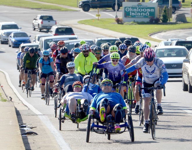 Veterans ride over Brooks Bridge on Wednesday as part of the UnitedHealthcare Gulf Coast Challenge Bike Tour that is part of the Ride 2 Recovery program of Project Hero. [NICK TOMECEK/DAILY NEWS]