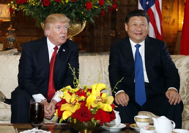 FILE - In this April 6, 2017 file photo, President Donald Trump and Chinese President Xi Jinping, sit as they pose for photographers before a meeting at Mar-a-Lago, in Palm Beach, Fla. Although the moment, protagonists and locations become enshrined in history books, major summits hold no guarantee of further progress. In some cases, the summit is as good as it gets as relations remain stagnant or plummet further. (AP Photo/Alex Brandon, File)