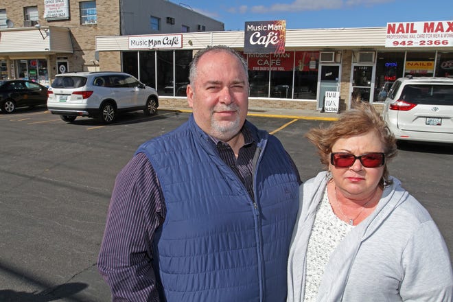 Al Saccoccia and his wife, Cheryl, opened the Music Man Cafe, behind them, in 2015.  [The Providence Journal/Steve Szydlowski]