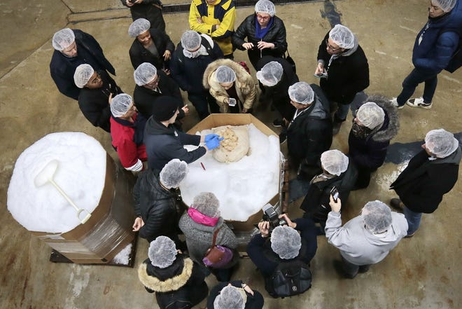 Seafood buyers from all over the world take a closer look at a pallet of scallops just unloaded at the Oceans Fleet processing plant during the International Seafood Buyers Visit to the New Bedford waterfront. 

[ PETER PEREIRA/THE STANDARD-TIMES/SCMG ]