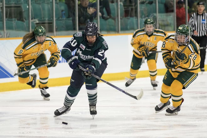 Mercyhurst's Emma Nuutinen (20) moves the puck up the ice against Clarkson during a NCAA women's hockey game in Potsdam, N.Y. on Saturday. Clarkson won 2-1 in overtime. [CONRAD KOEHLER/CLARKSON ATHLETICS]