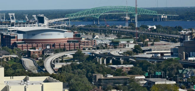 The Hart Bridge sends traffic into downtown via an elevated roadway along Bay street that leads to ramps for Duval Street and Adams Street, shown in the foreground. Mayor Lenny Curry is seeking a mix of city, state and federal money for a $50 million project that would demolish a portion of the ramp along Bay Street, bringing traffic to ground level in that stretch. [FILE/FLORIDA TIMES-UNION]