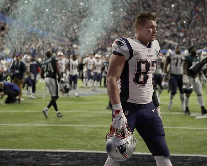 New England Patriots' Rob Gronkowski walks off the field after the NFL Super Bowl 52 five weeks ago. He said after the game he was uncertain about his future, and hasn't provided many clues since. [Chris O'Meara/The Associated Press]