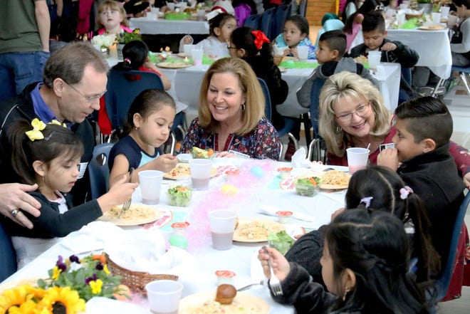 Ameriprise Financial Partners in Education mentors Kenneth Siebenmorgen, from left, Janet Morgan and Kay Adams join Morrison Elementary School students Friday, March 9, 2018, for the third annual Morrison Elementary School Fine Dining Event at the school cafeteria. More than 380 students had the opportunity to be waited on, served and serenaded with live music at the special event that introduces "real" dining experiences to the children. [JAMIE MITCHELL/TIMES RECORD]