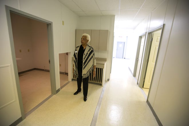 Carolyn Adams stands in the Estella Byrd Whitman Wellness and Community Resource Center and talks about the struggles to open the facility. [Alan Youngblood/Staff photographer]