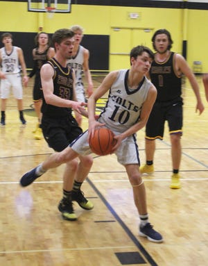 Lukas Tharp(pictured) led Hillsdale Academy to a 72-52 win over Plymouth Christian in the regional opener at Lansing Christian on Monday night. [ANDREW KING PHOTO]