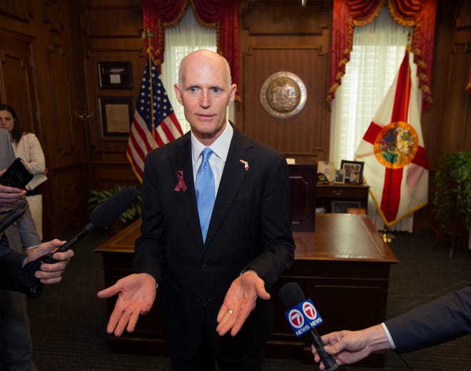 Florida Gov. Rick Scott talks to the media in his office after signing the Marjory Stoneman Douglas Public Safety Act at the Florida Capital on Friday. With the legislative session over, Scott is turning his attention to a possible U.S. Senate bid. [AP Photo / Mark Wallheiser]