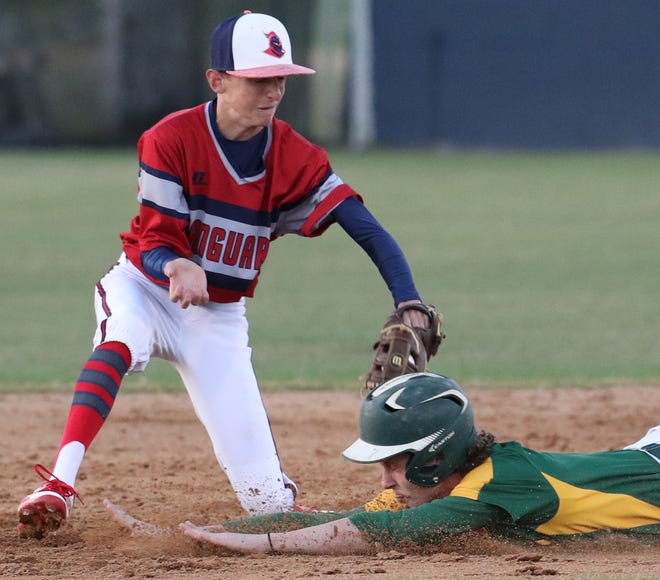 Vanguard's Cody Antonucci (8) tags out Lecanto's Dustin Fisher (3) at second base during the Knights' 7-1 win on Tuesday night at Vanguard High School in Ocala. [Bruce Ackerman/Staff photographer]