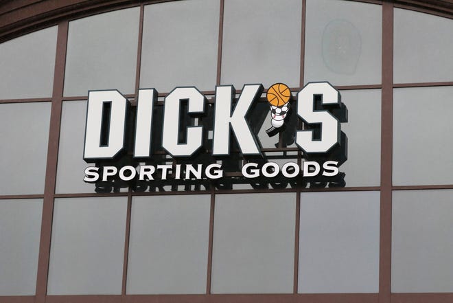 FILE- In this March 1, 2018, file photo, a sign for Dick's Sporting Goods store is displayed at the store in Madison, Miss. Dick's Sporting Goods, Inc. reports earnings Tuesday, March 13, 2018. (AP Photo/Rogelio V. Solis, File)