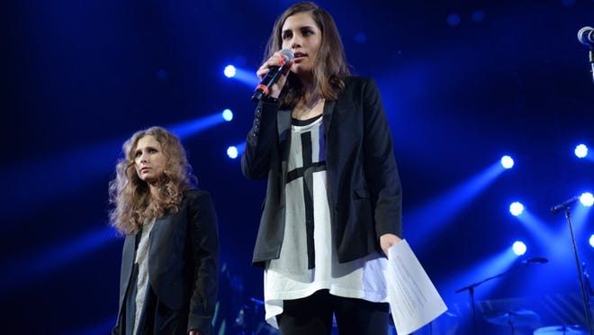 Members of Pussy Riot, Maria Alekhina, left, and Nadya Tolokonnikova speak at Amnesty International's "Bringing Human Rights Home" Concert at the Barclays Center on Wednesday, Feb. 5, 2014 in New York.