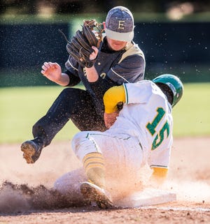 West Davidson's Doulton Anderson (right) collides with East Davidson's Zach Stevens during their game on Wednesday at Feezor Field. [Dan Busey/The Dispatch]