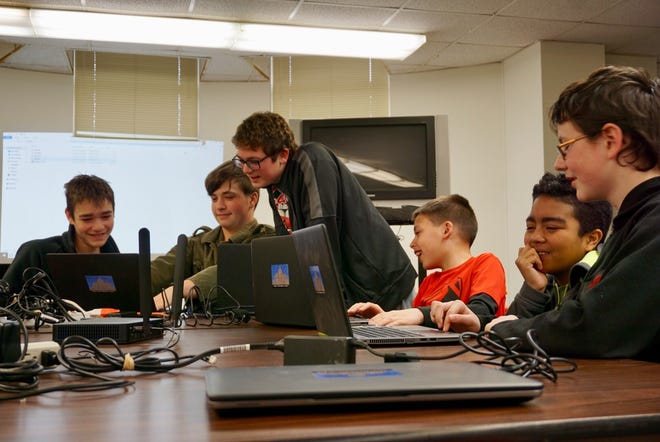 Teens gathered on Tuesday in the basement of the Lincoln Public Library to learn the basics of videogame programming during one of five Teen Tech Week events March 12-16. [Photo by The Courier]