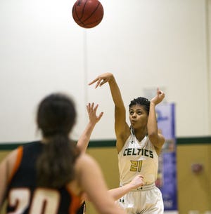 Trinity Catholic's Sydney James puts up a 3 against Umatilla on Jan. 23 at Trinity Catholic in Ocala. James, a sophomore, was recently named Florida Dairy Farmers Class 5A Player of the Year. [Cyndi Chambers/Correspondent/File]