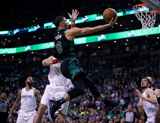 Boston's Jayson Tatum drives to the basket in the first quarter.