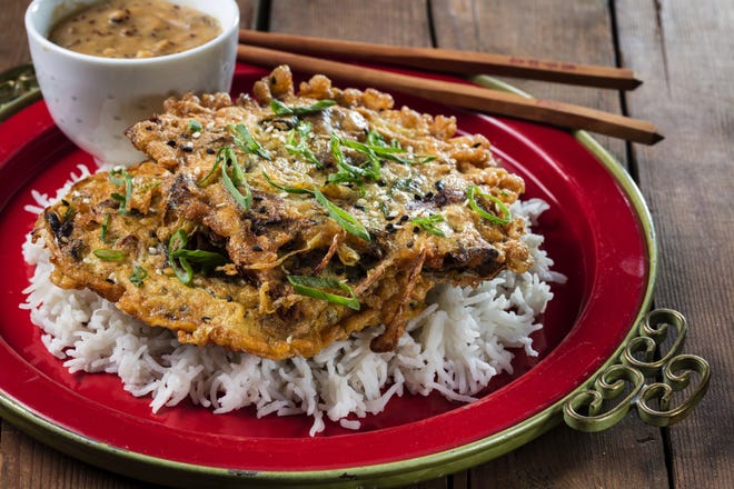 Egg foo young with mushrooms and bean sprouts, served over rice with a mushroom gravy; styling by Mark Graham. [Zbigniew Bzdak/Chicago Tribune/TNS]
