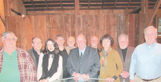 Jason Green, center the new executive director of Allison-Antrim Museum, is shown with board members in the German bank barn at the museum. From left: Don Rice; Wade Burkholder; Ariel Sherrill; Craig Ingram; Ralph Dice; Green; Ed Beard; Bonnie Shockey, president and CEO; Bruce Z. McLanahan, vice president; and Dave McCarney, treasurer. Not pictured: Gloria Walker, Fred Davison and Ted Alexander. SHAWN HARDY/ECHO PILOT.