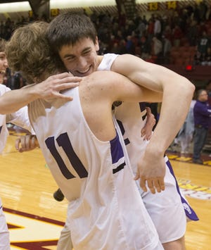 After the final buzzer in double overtime Jackson's Jaret Pallotta (11) celebrates with Jake Byers who hit the winning free throw defeating McKinley 66-65 on Saturday March 10, 2018. (CantonRep.com / Bob Rossiter)