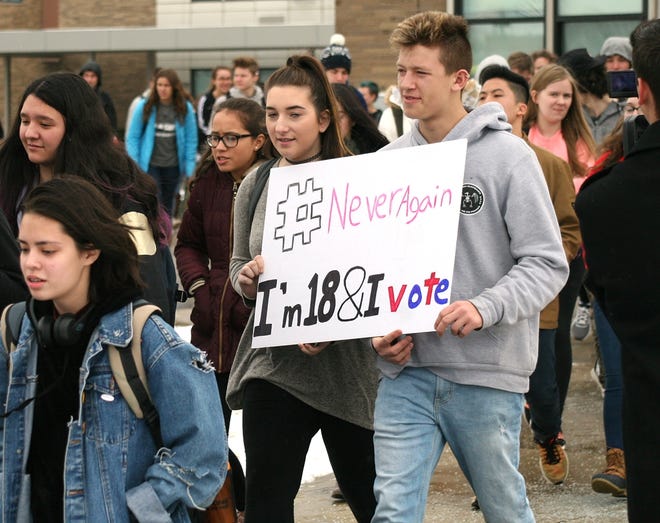 Students at Corning-Painted Post High School leave the school and head to the track during the national walkout Wednesday. [SHAWN VARGO/THE LEADER]