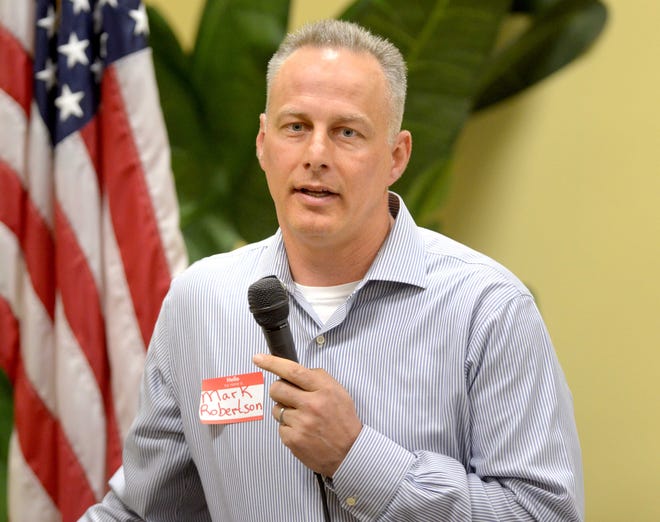 Mark Roberton, candidate for Destin City Council, speaks to a group recently before the election. [NICK TOMECEK/DAILY NEWS]