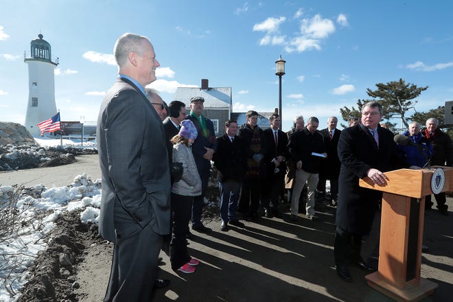 Scituate Selectman John Danehey welcomes Gov. Charlie Baker to Scituate after his arrival to the coastal town for a press conference at Scituate Lighthouse on Thursday, March 15, 2018 to discuss a climate change bond bill. 

[Wicked Local Staff Photo/Robin Chan]