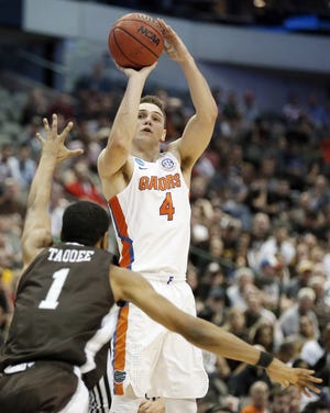 Florida guard Egor Koulechov (4) attempts a shot as St. Bonaventure guard Idris Taqqee (1) defends during the second half of an NCAA Tournament game Thursday in Dallas. [AP Photo/Brandon Wade]