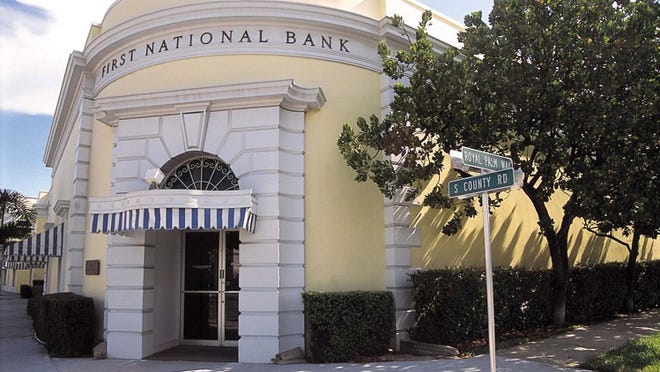The First National Bank sign seen here will be changed if the Town Council agrees with the Landmarks board’s recommendation. Daily News file photo
