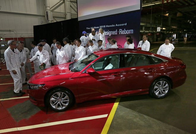 Honda employees celebrated the production of their redesigned 2018 Accord sedan shortly after the first one rolled off the production line this past Sept. 18 at the Honda of America Manufacturing plant in Marysville. [Adam Cairns/Dispatch]