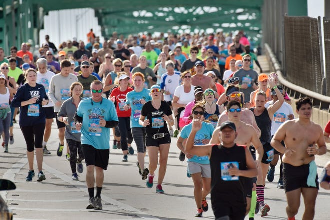 Runners make their way down the Hart Bridge during the Gate River Run Saturday, March 10. It was just one of many events that weekend in a busy Downtown Jacksonville. (Will Dickey/Florida Times-Union)