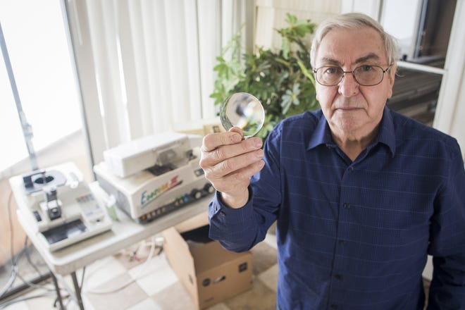 Donald Fortin, a member of the Lions Club of Charlton, shows a lens that is part of a large donation of lenses, valued at $300,000, by Jon Haglund of Shrewsbury. Mr. Haglund’s donation will help an estimated 60,000 needy people receive new corrective lenses. [T&G Staff/Ashley Green]