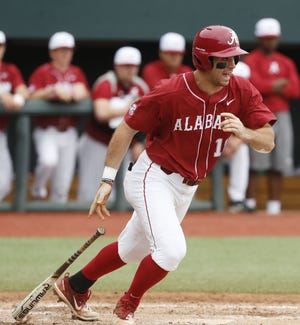 Alabama outfielder Keith Holcombe (18) runs to first after hitting a chopper on the infield in Sewell-Thomas Stadium as the Tide and the Bulldogs played the rubber game of their weekend SEC opening series Sunday, March 18, 2018. [Staff Photo/Gary Cosby Jr.]