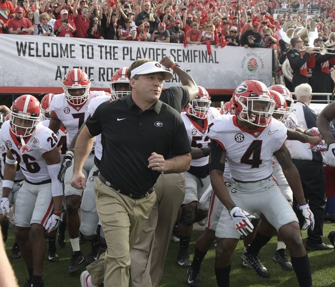 Georgia head coach Kirby Smart leads the team onto the field during the Bulldogs' Rose Bowl game against the Oklahoma Sooners in Pasadena, California on Monday, Jan. 1, 2018 (Photo by John Kelley/UGA)