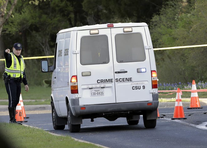 A police crime scene van arrives near the site of Sunday's deadly explosion in Austin, Texas. Police warned nearby residents to remain indoors overnight as investigators looked for possible links to other package bombings elsewhere in the city this month. [AP Photo/Eric Gay]