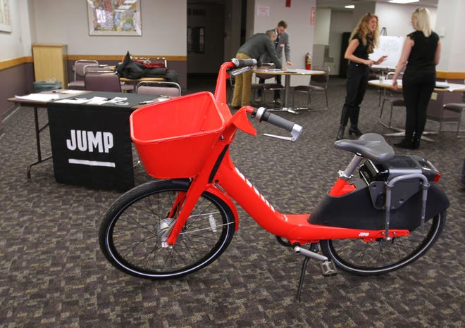 Bike-share company Jump Bikes will be stationing 400 electric-assisted bicycles like this across Providence starting this summer as a low-cost transportation option for people who live in and work in the city. An electric front hub provides a power boost on hills. [The Providence Journal / Steve Szydlowski ]